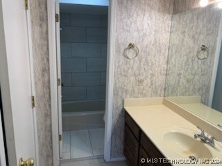 bathroom featuring tile patterned floors and vanity