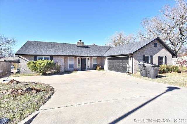 ranch-style home featuring a garage