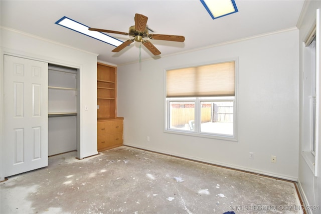 unfurnished bedroom featuring a closet, ceiling fan, and crown molding