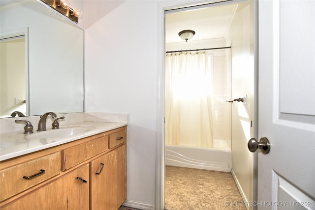 bathroom with shower / bath combo, vanity, and ornamental molding