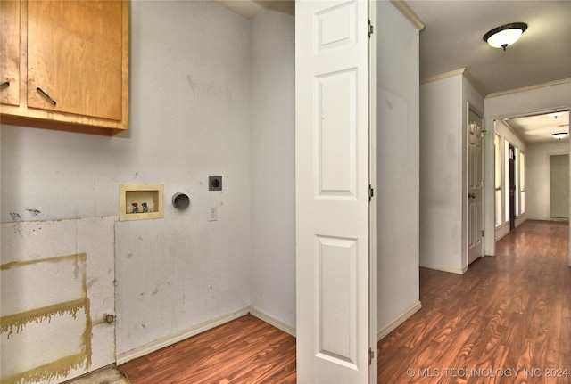 washroom featuring hookup for an electric dryer, crown molding, dark wood-type flooring, and washer hookup