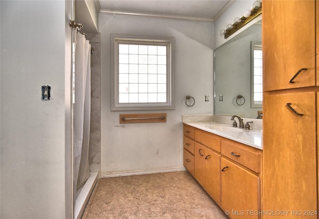 bathroom with vanity, curtained shower, and crown molding