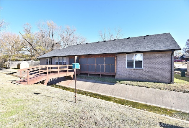 rear view of house featuring a deck