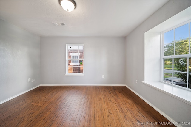 spare room featuring hardwood / wood-style flooring