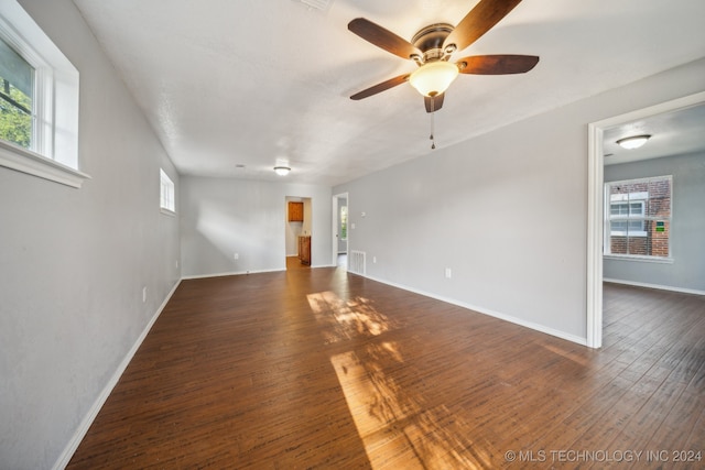 spare room featuring dark hardwood / wood-style floors and ceiling fan