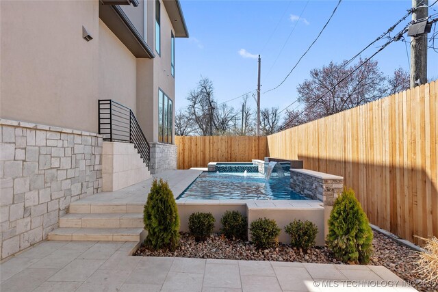 exterior space featuring a fenced backyard