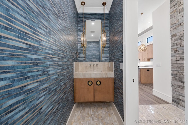 bathroom with vanity and wood finished floors