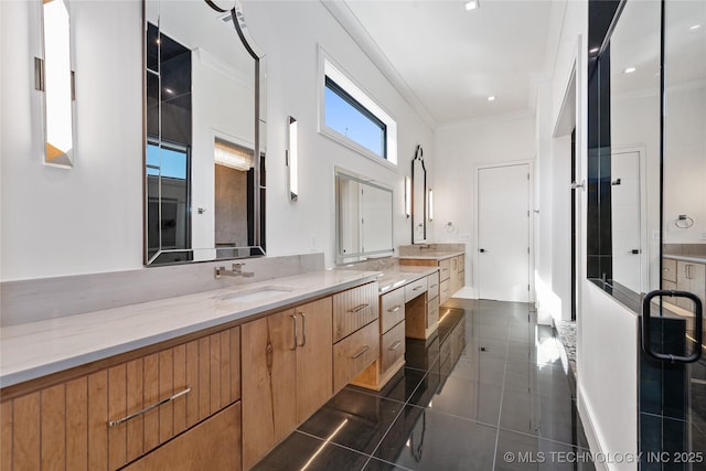 bathroom featuring ornamental molding, vanity, and tile patterned flooring