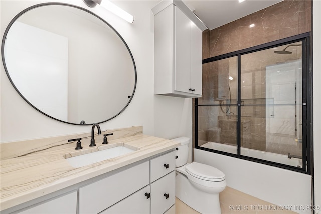 bathroom with combined bath / shower with glass door, toilet, and vanity