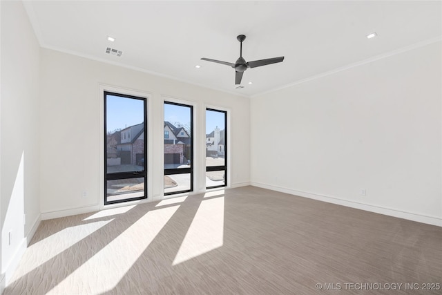 spare room featuring baseboards, visible vents, recessed lighting, ceiling fan, and ornamental molding