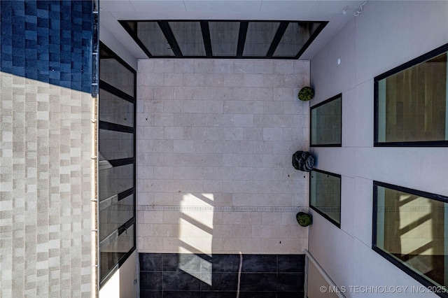 bathroom with tile walls