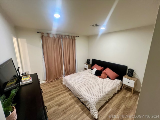 bedroom featuring light hardwood / wood-style flooring