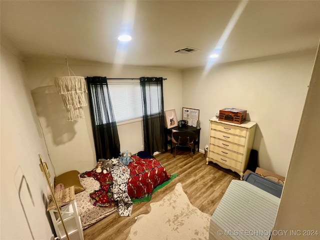 bedroom featuring hardwood / wood-style flooring