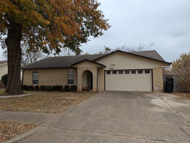 ranch-style house featuring a garage