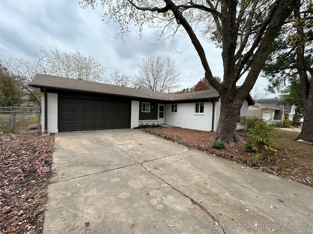 single story home featuring a garage