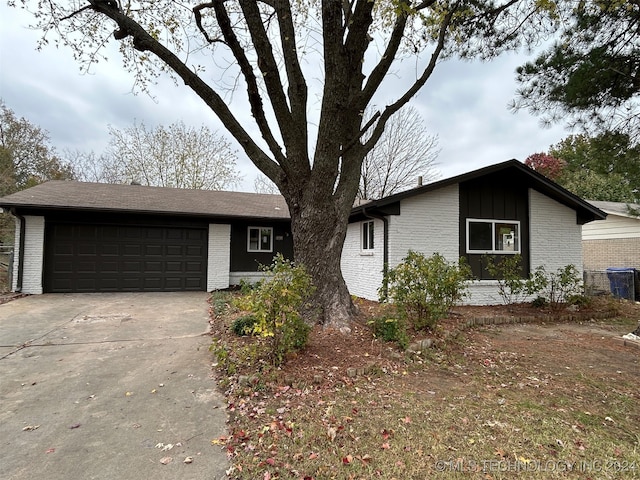 ranch-style house featuring a garage