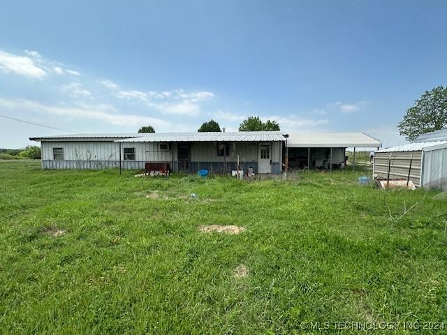 340 Clay Hl, Lone Grove, OK 73443 - rear view of house with a lawn and an outbuilding