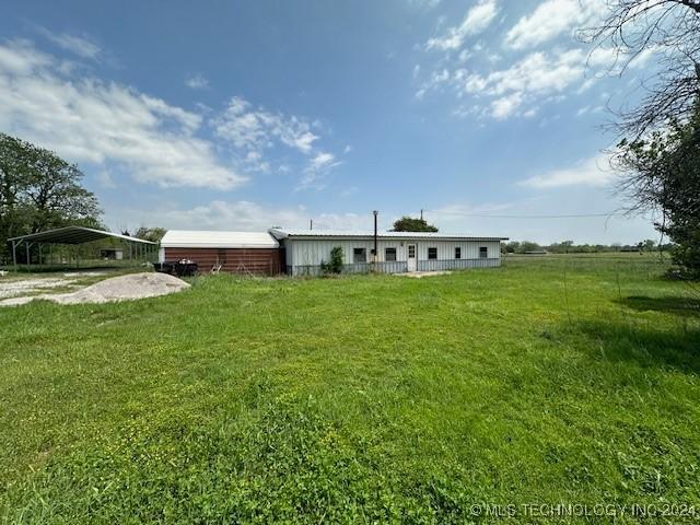 340 Clay Hl, Lone Grove, OK 73443 - view of front of home featuring a front lawn and a carport