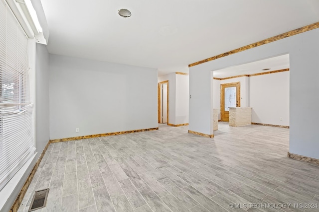 spare room with light hardwood / wood-style floors