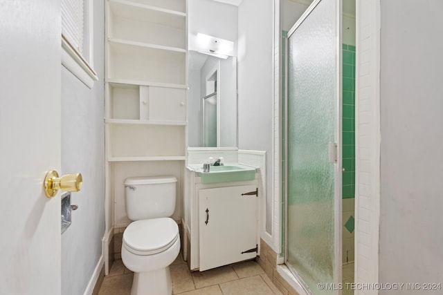 bathroom featuring tile patterned floors, vanity, walk in shower, and toilet