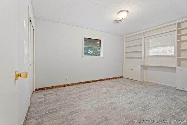 empty room featuring a textured ceiling