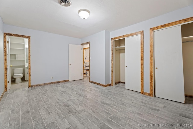 unfurnished bedroom featuring ensuite bath