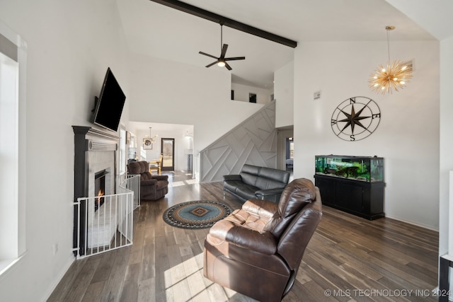 living room with beamed ceiling, ceiling fan with notable chandelier, dark wood-type flooring, and high vaulted ceiling