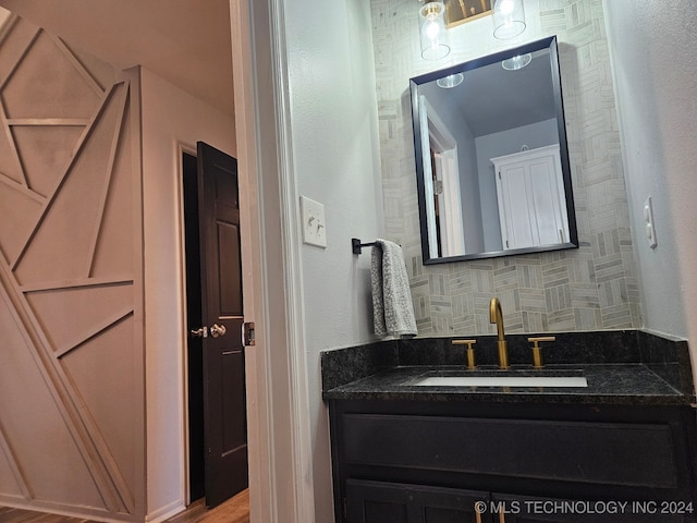 bathroom with vanity and wood-type flooring