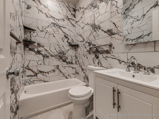 full bathroom with vanity, bathing tub / shower combination, tile patterned flooring, toilet, and tile walls