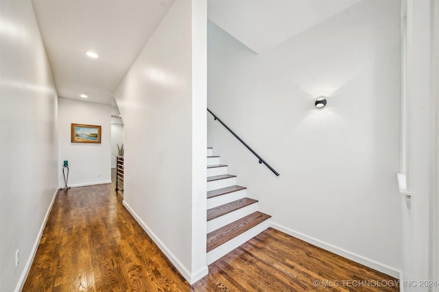 hallway featuring dark hardwood / wood-style flooring