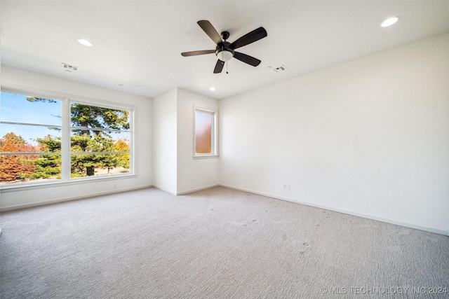 unfurnished room with ceiling fan and carpet floors