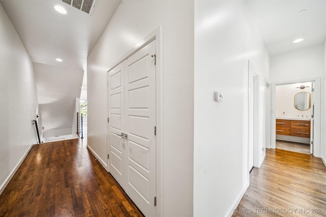 corridor featuring dark hardwood / wood-style floors