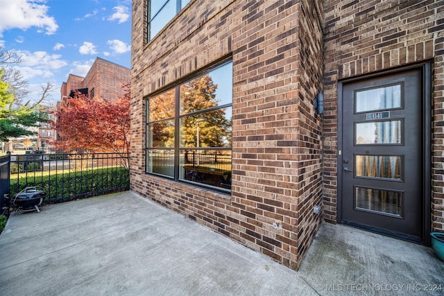 property entrance with a patio