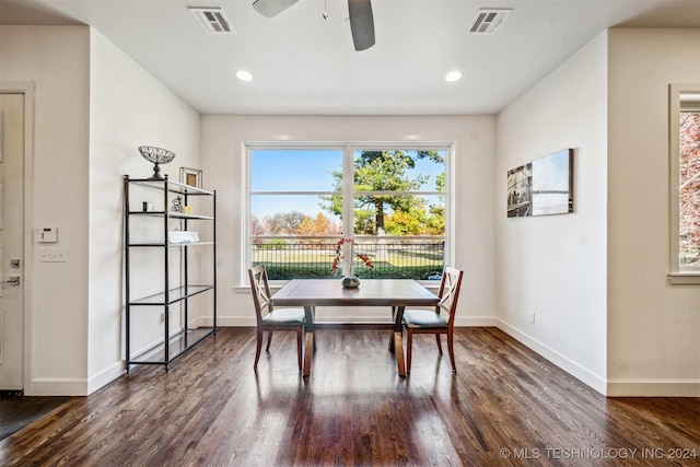 dining space featuring ceiling fan and dark hardwood / wood-style flooring