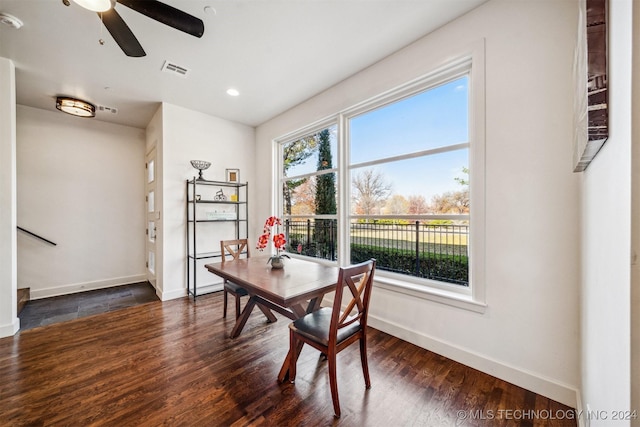 dining space featuring dark hardwood / wood-style flooring and ceiling fan