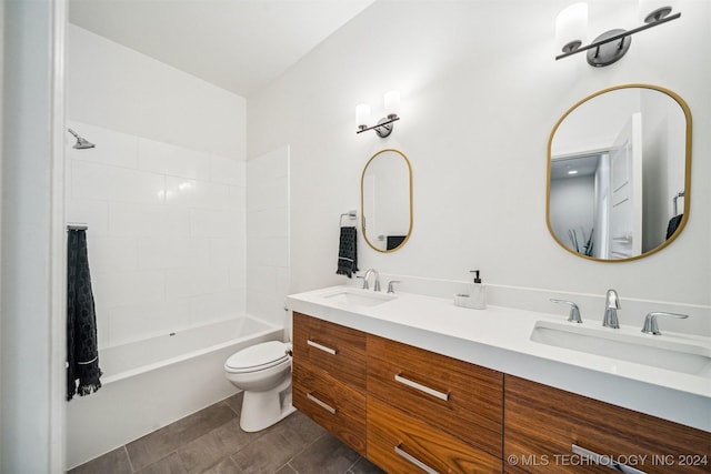 full bathroom with tile patterned floors, vanity, shower / bathtub combination, and toilet