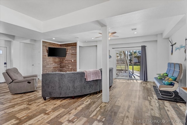 living room featuring ceiling fan and wood-type flooring