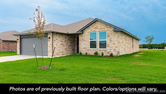 view of front of house with a garage and a front lawn