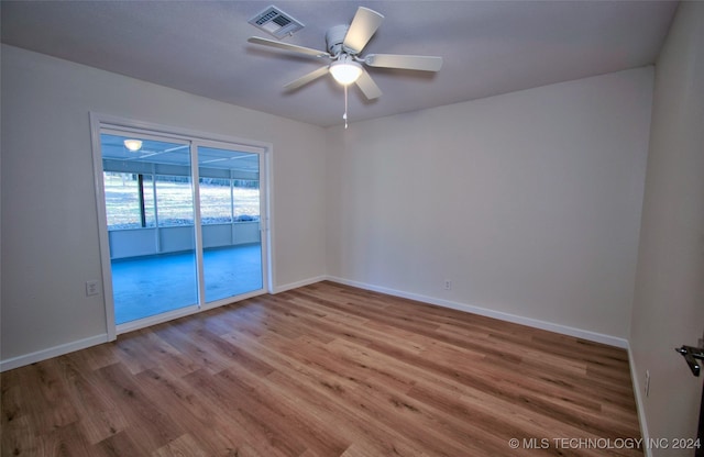 unfurnished room with ceiling fan and light wood-type flooring