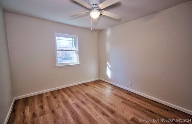 empty room with light hardwood / wood-style floors and ceiling fan