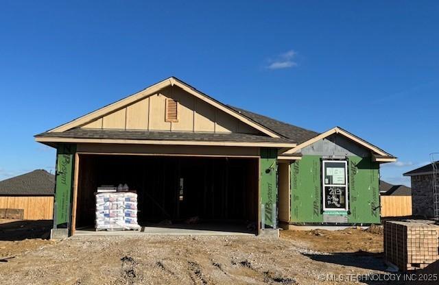 property in mid-construction with a garage