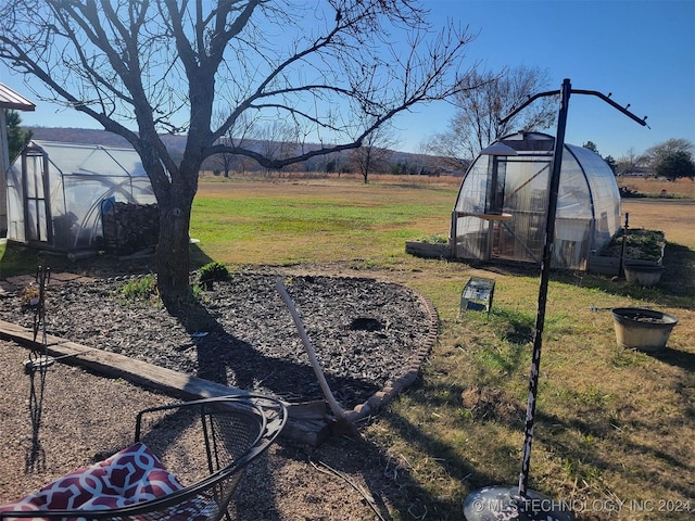 view of yard featuring an outbuilding and a rural view