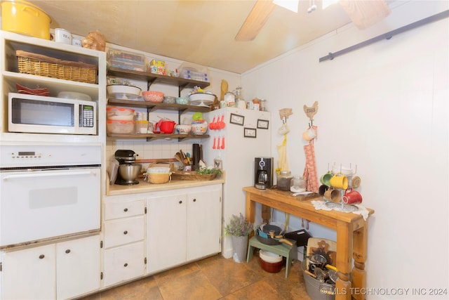 kitchen featuring ceiling fan, white cabinetry, white appliances, and tasteful backsplash