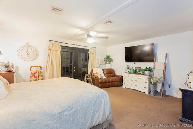 bedroom with ceiling fan, french doors, and carpet