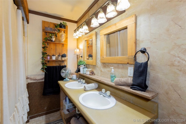 bathroom with tile patterned flooring, vanity, and ornamental molding