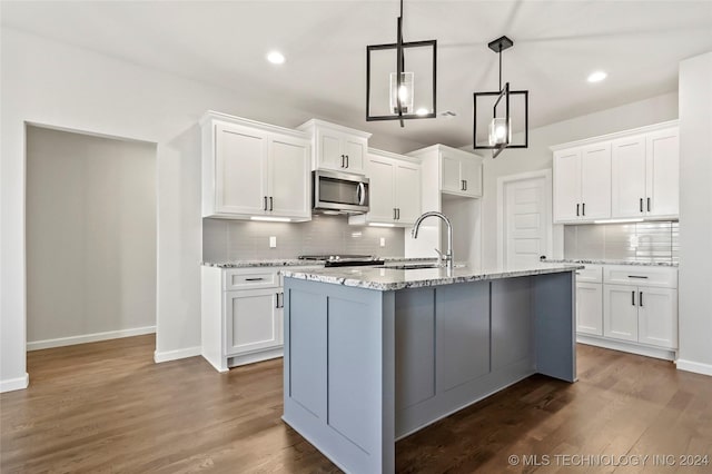 kitchen with appliances with stainless steel finishes and white cabinetry