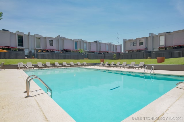 view of swimming pool featuring a patio area