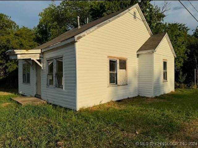 view of home's exterior featuring a yard