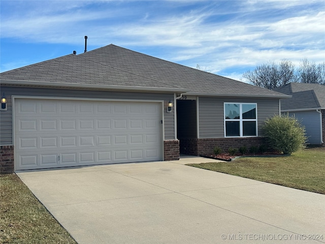 single story home featuring a garage