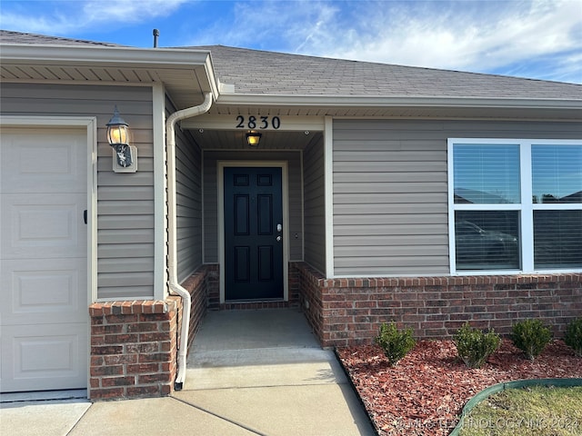 entrance to property featuring a garage